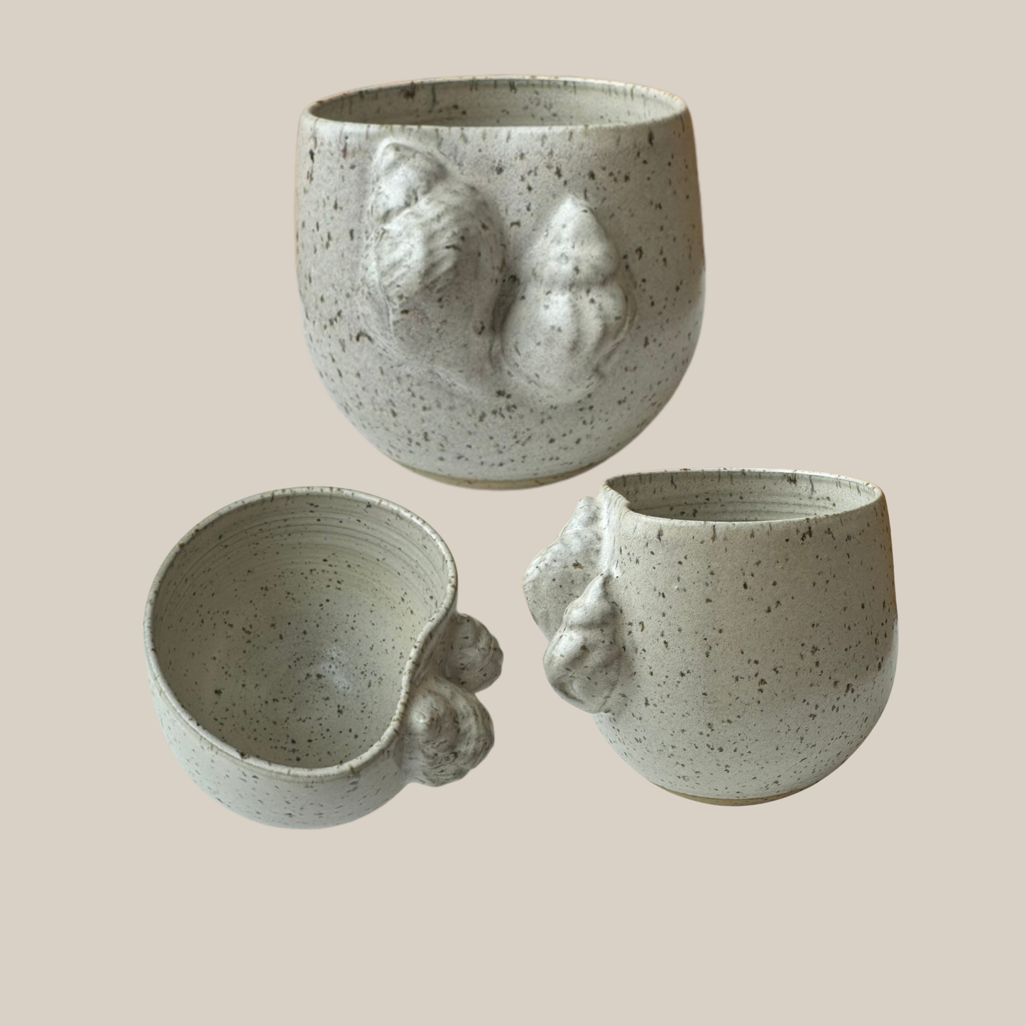 Beige keramik kop Konkylier